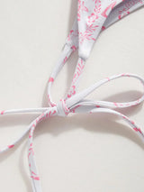 Ensemble bikini col V à nouer avec fleurs et sarong en dentelle assorti